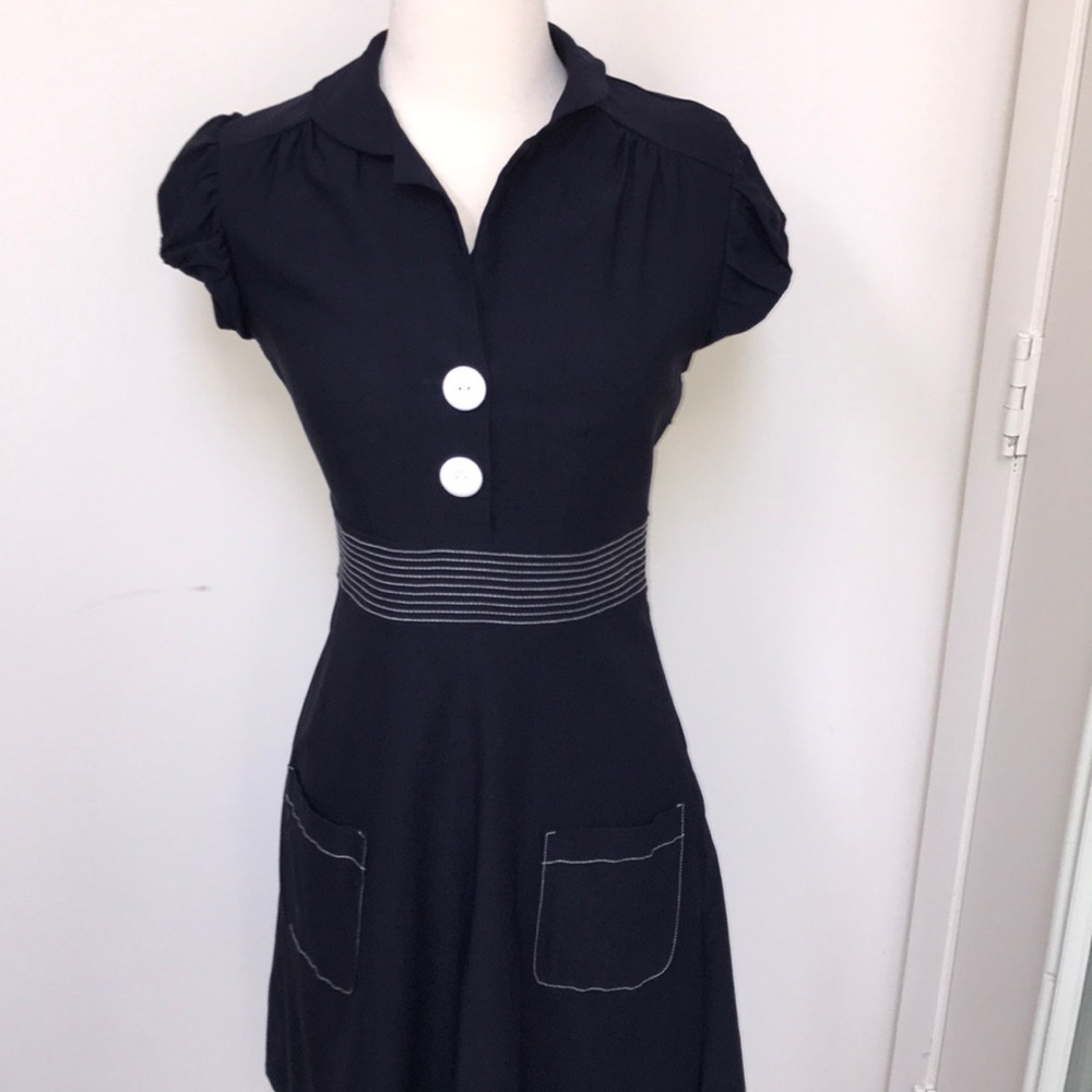 Navy blue dress with white buttons
